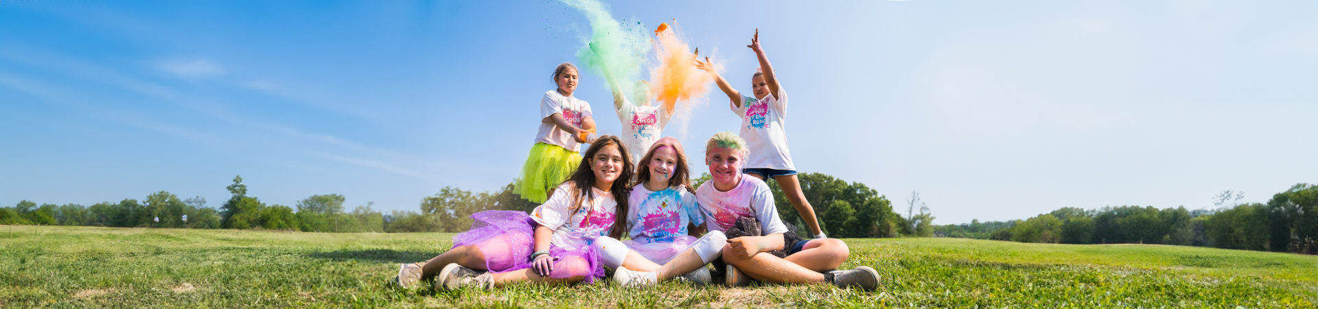  Girl Scouts outside at a color run event 