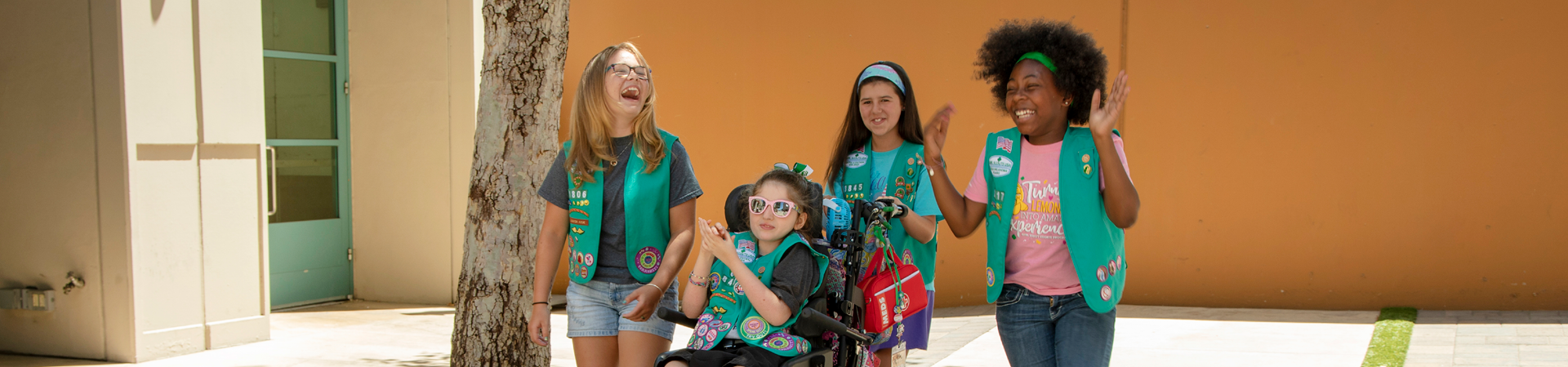  group of Girl Scout Juniors standing outside and laughing 