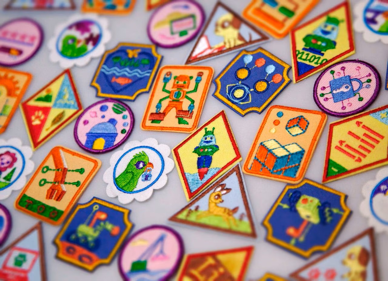  various Girl Scout badges on a light purple background 