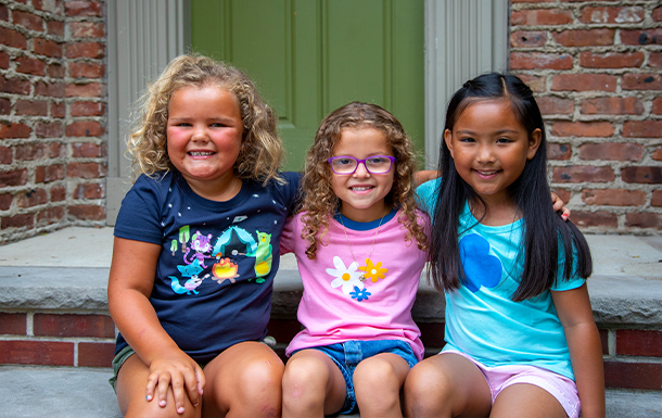 group of Girl Scout Daisies sitting outside together