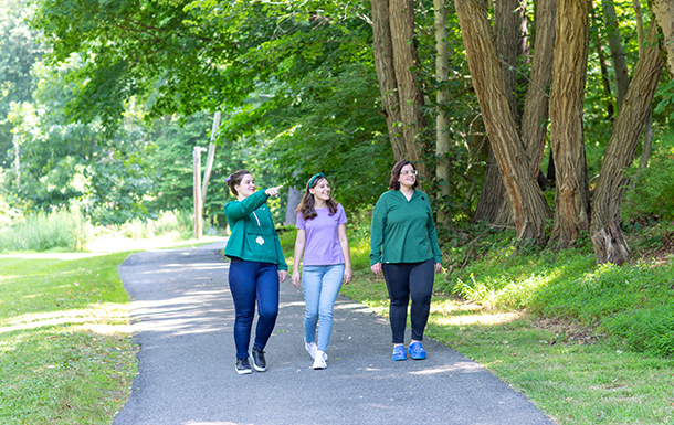 family walking along an outdoor trail