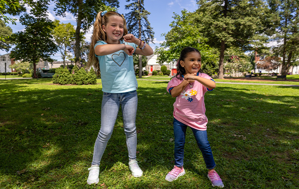 Girl Scouts playing a dancing game outdoors