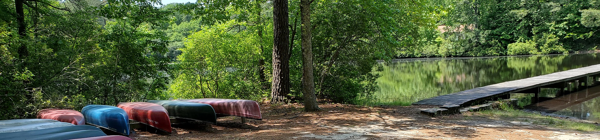  Canoes ready to go by the water at Camp Darden in Courtland, Virginia 