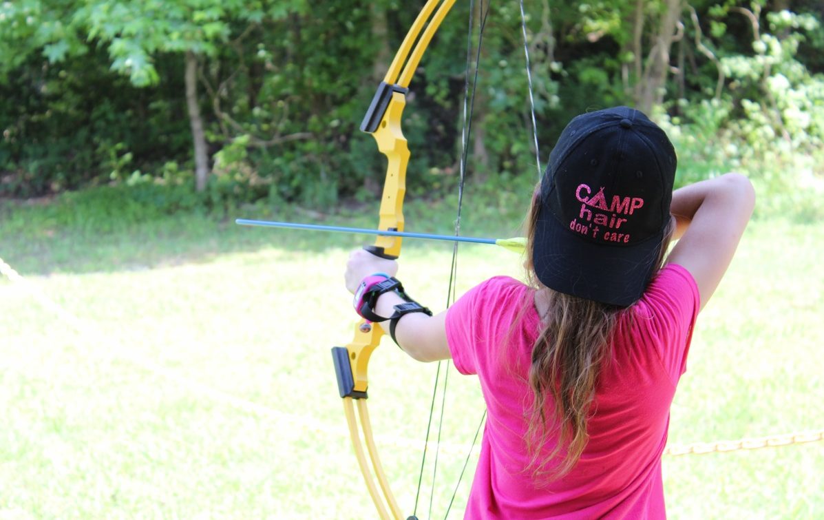 Girl Scout practicing archery at Camp Darden