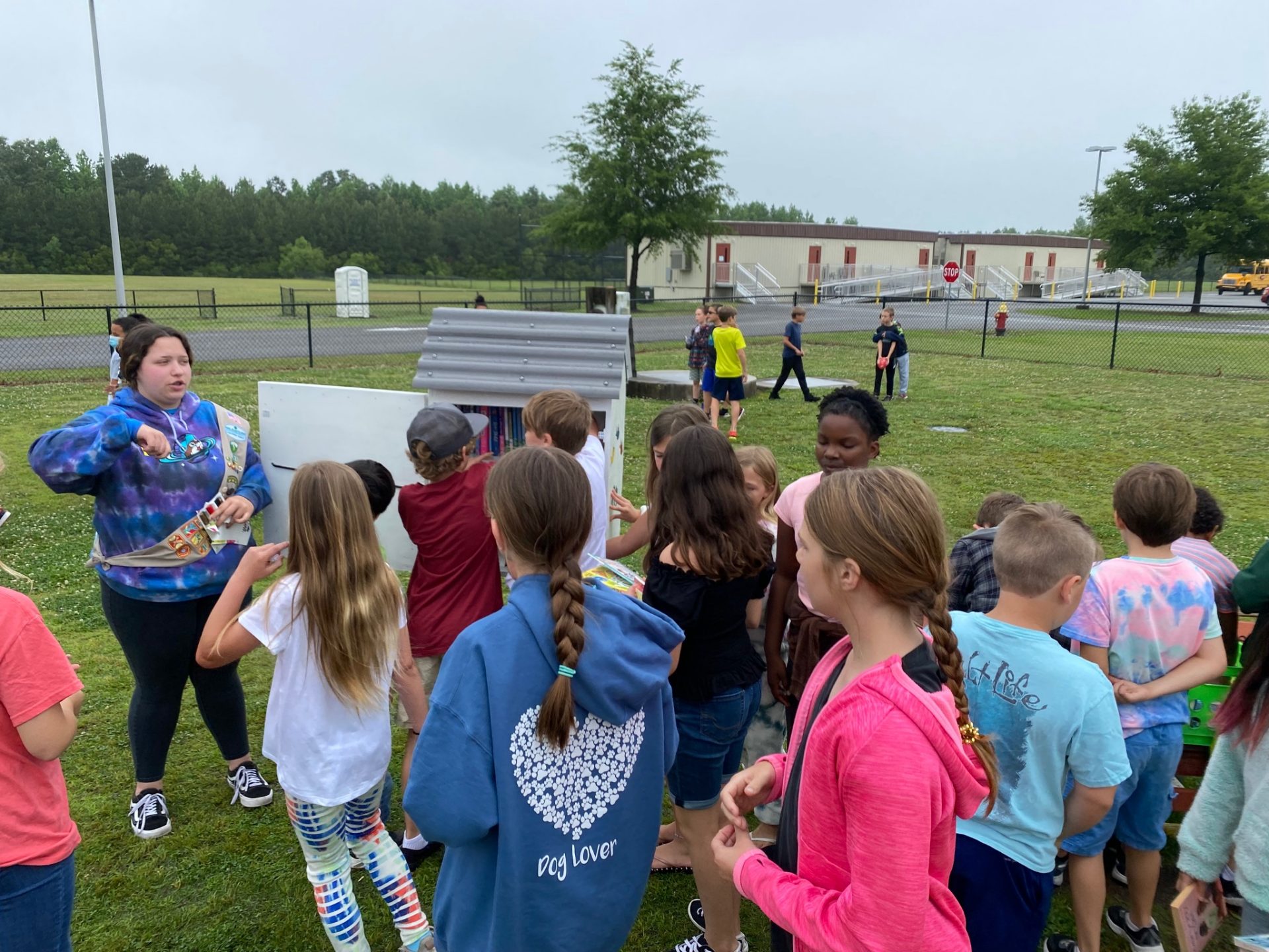  Girl Scout Ambassador Victoria in Troop 52 created a literacy box outside of Shawboro Elementary School to provide free books for children in the area, many of whom suffered grade level setbacks due to COVID. 