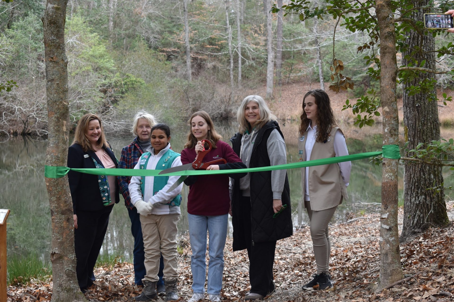  Girl Scouts celebrated their 111th birthday by dedicating a new pond aeration system at Camp Skimino 