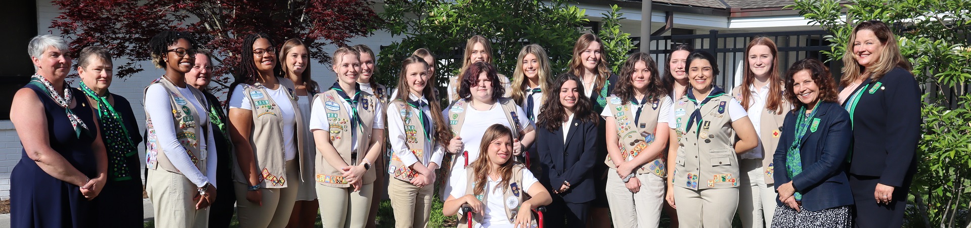  Gold Award Girl Scouts with GSCCC Gold Award Committee members outdoors at awards event  