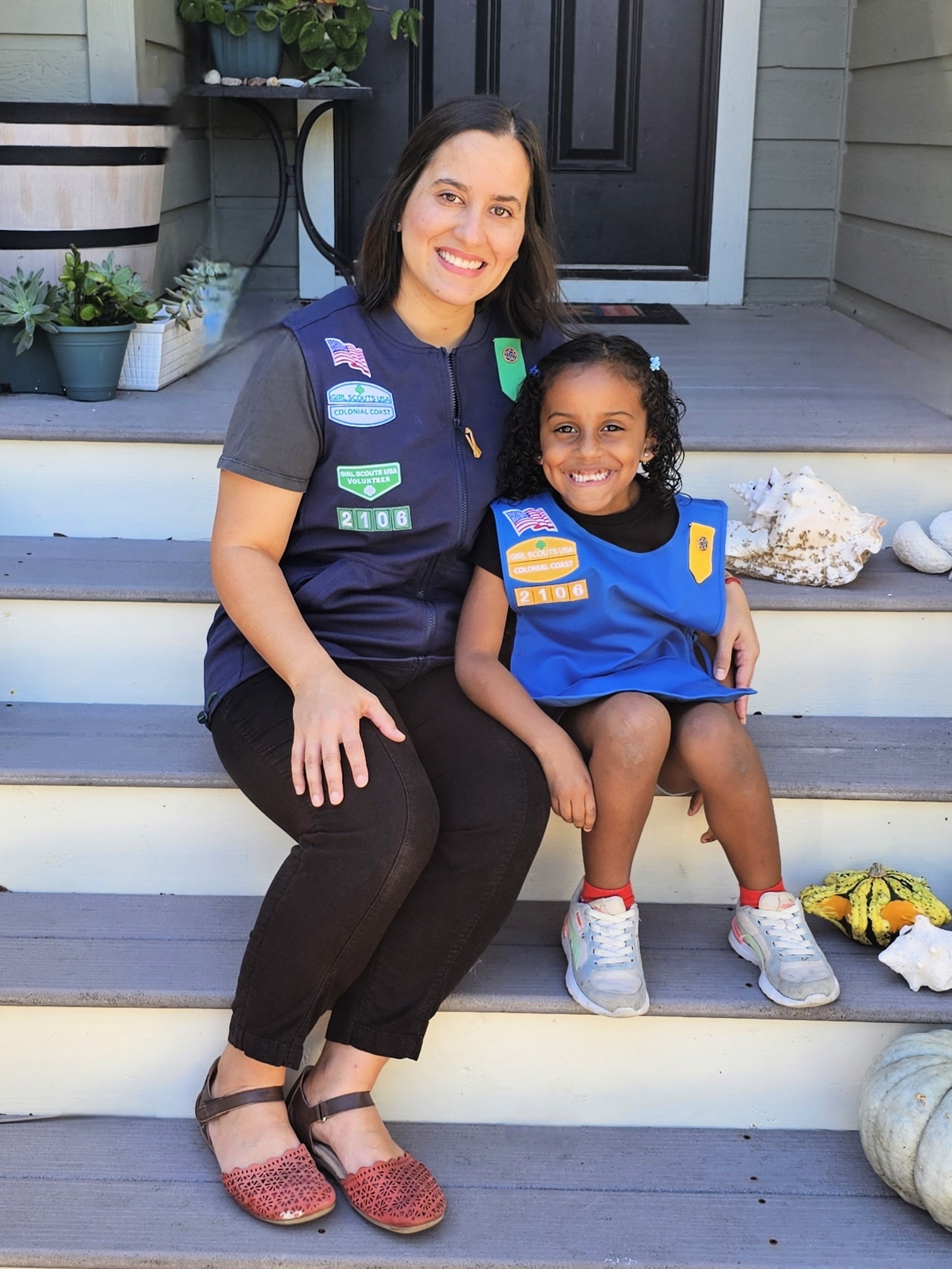 Adult volunteer troop leader with a Daisy Girl Scout