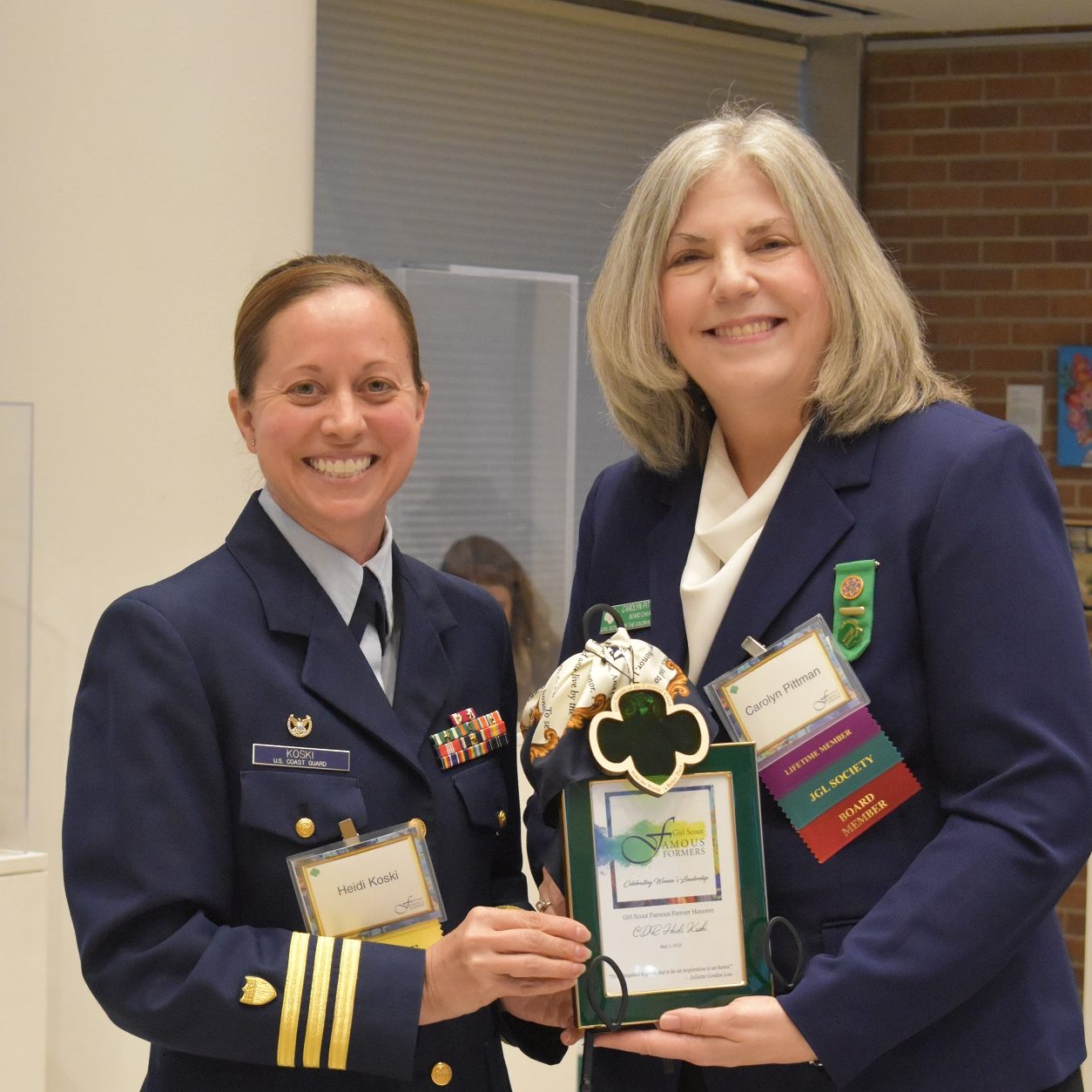 CDR Heidi Koski, Commanding Officer of U.S. Coast Guard Base, Elizabeth City, with GSCCC Board Chair Carolyn Pittman