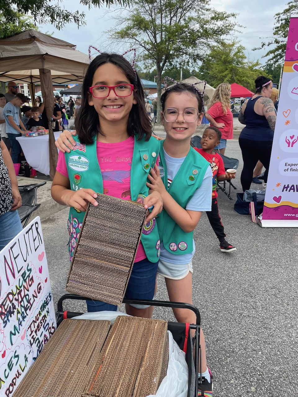 Girl Scout Juniors Evelyn and Lucy from Troop 422 in Suffolk repurposed cookie cases into fun cat scratchers