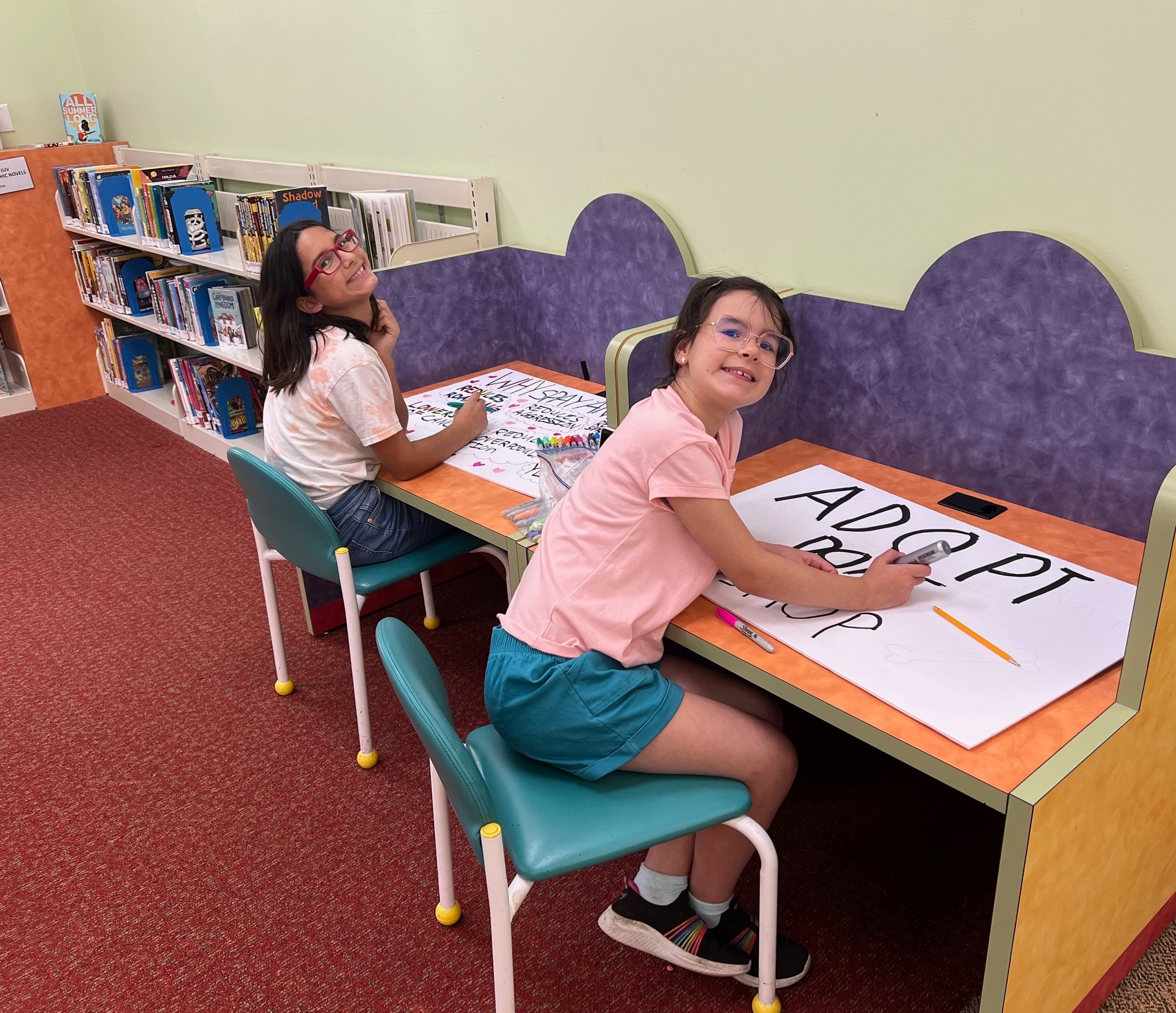 Girl Scout Juniors Evelyn and Lucy from Troop 422 in Suffolk working on their Bronze Award project