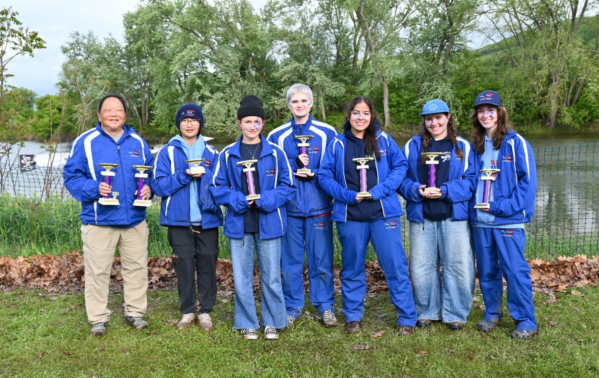 Girl Scout Blazing Blue Herons with their trophies, all smiles after the races