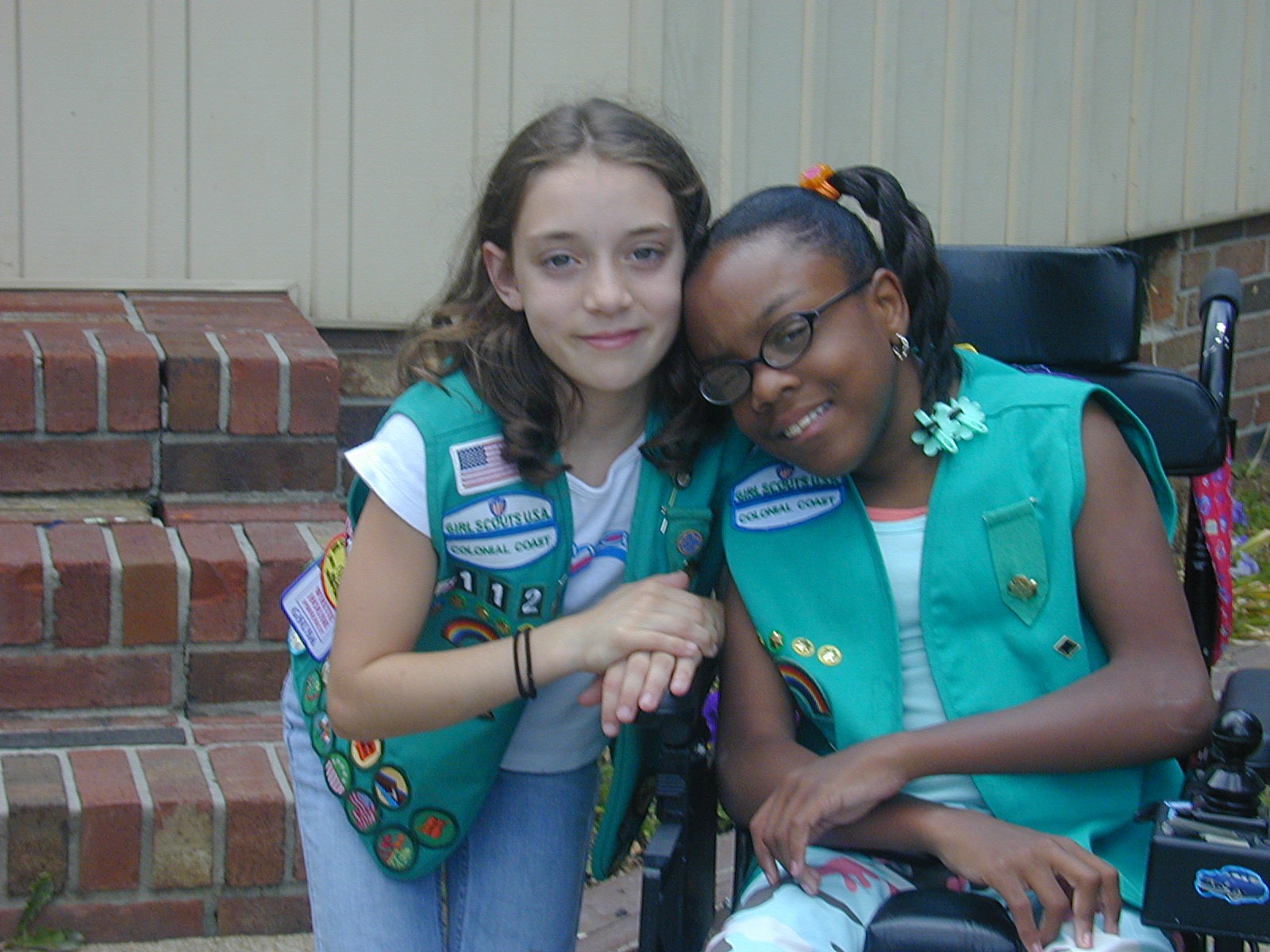 Tori Lincoln as a Girl Scout Junior with another Girl Scout in a wheelchair