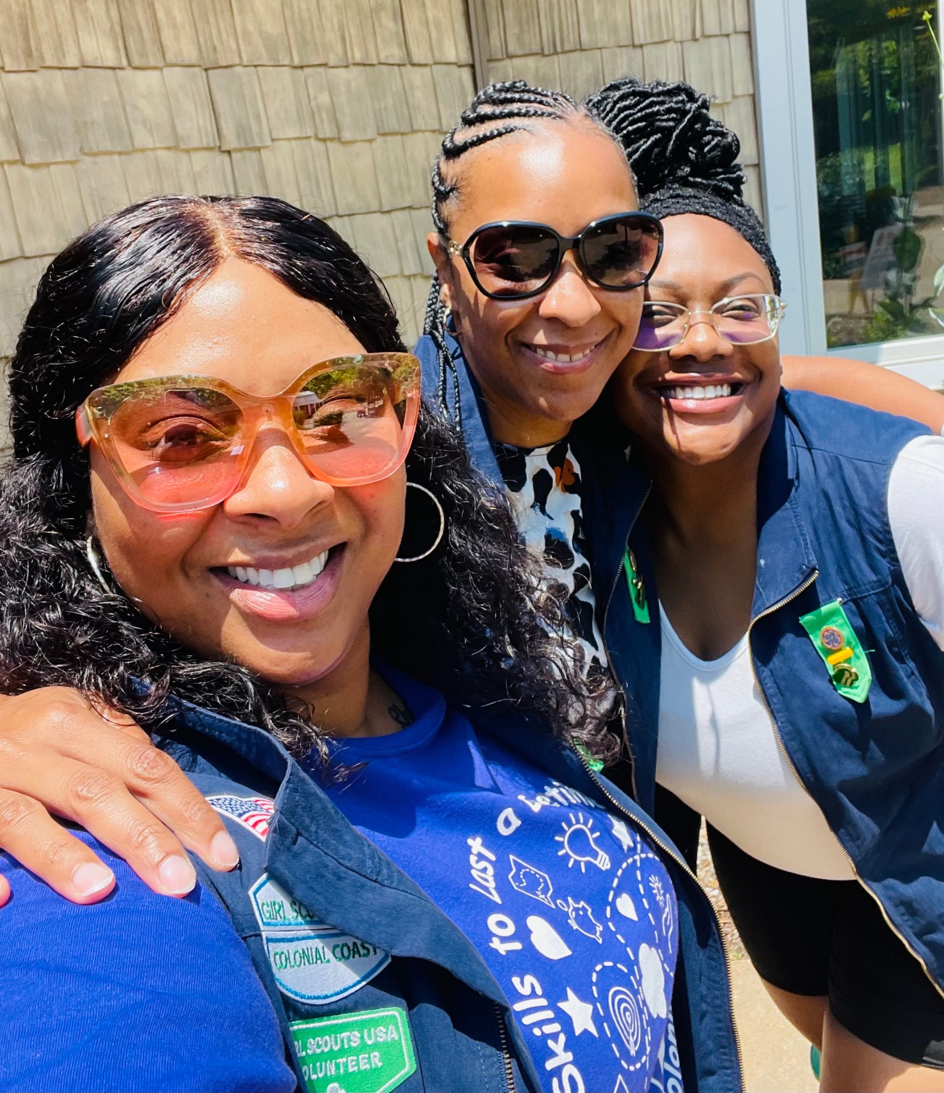 Alexis Majied (center) with other Girl Scout volunteers