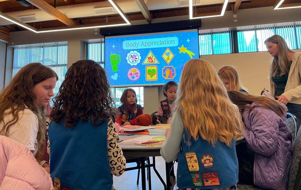 Girl Scout Daisies and Brownies work on a badge activity with the Kappa Deltas