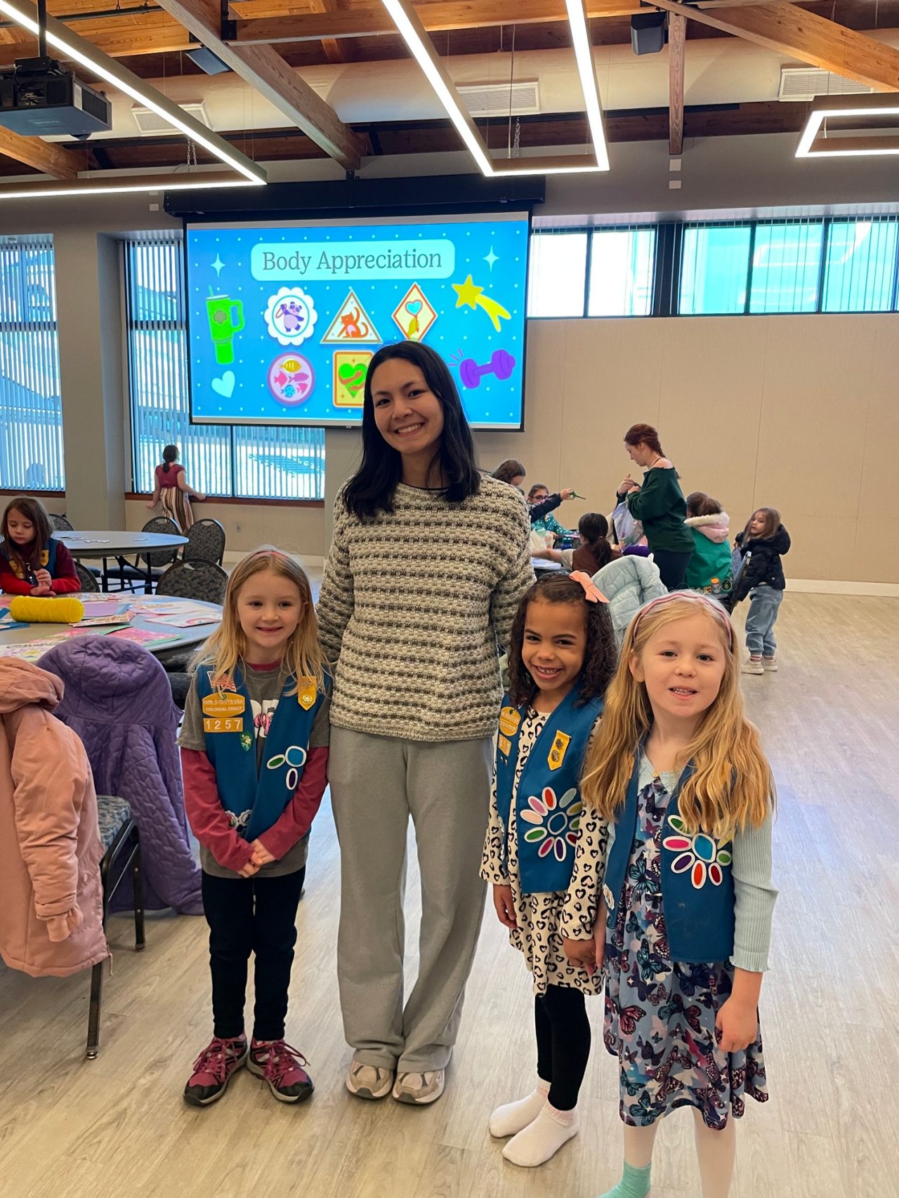 Girl Scout Daisies pose for a photo with a Kappa Delta sister