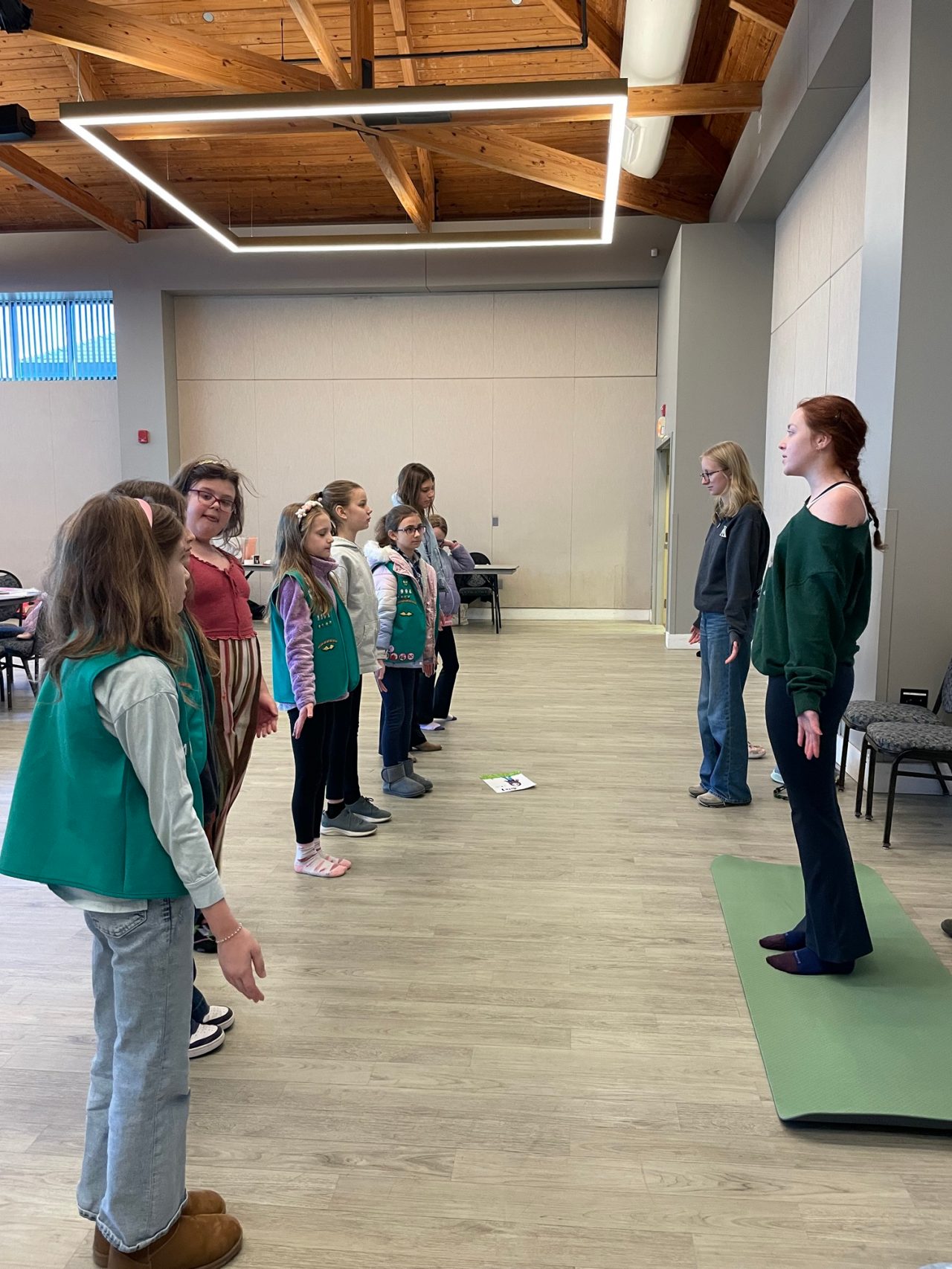 Kappa Deltas lead Girl Scouts in a movement activity
