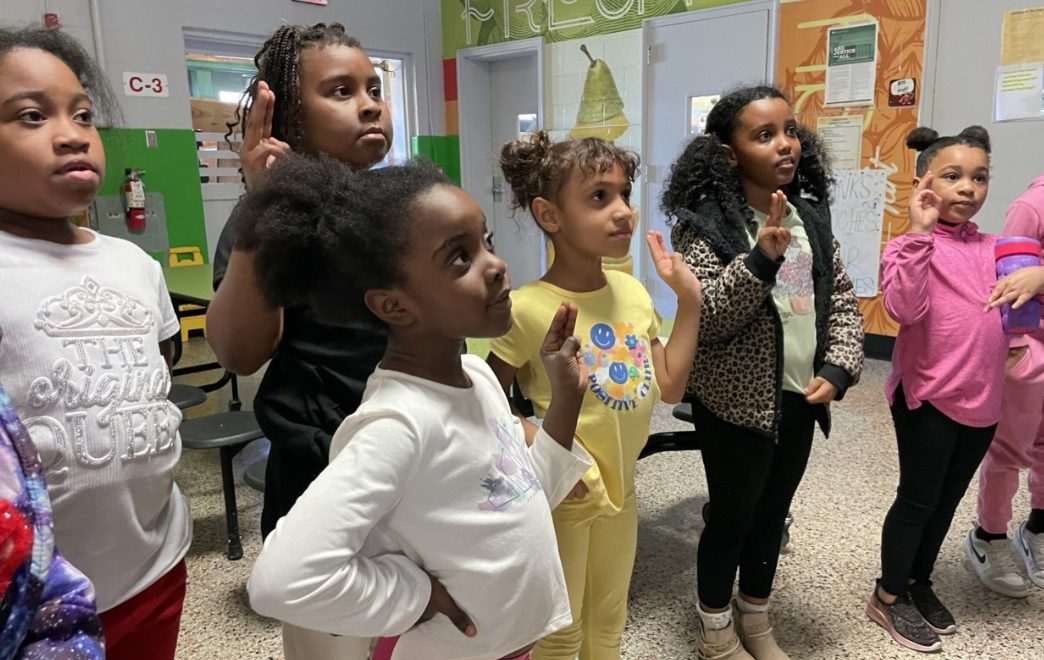 Community Troop 1114 recites the Girl Scout Promise and Law