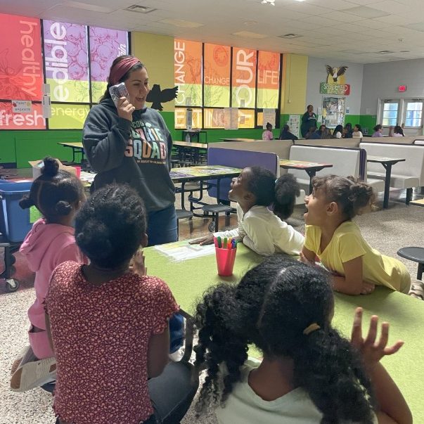 Community Troop Manager Daniela Ragsdale leads an activity