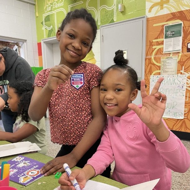 Girl Scout Brownies in Troop 1114 work on a patch activity