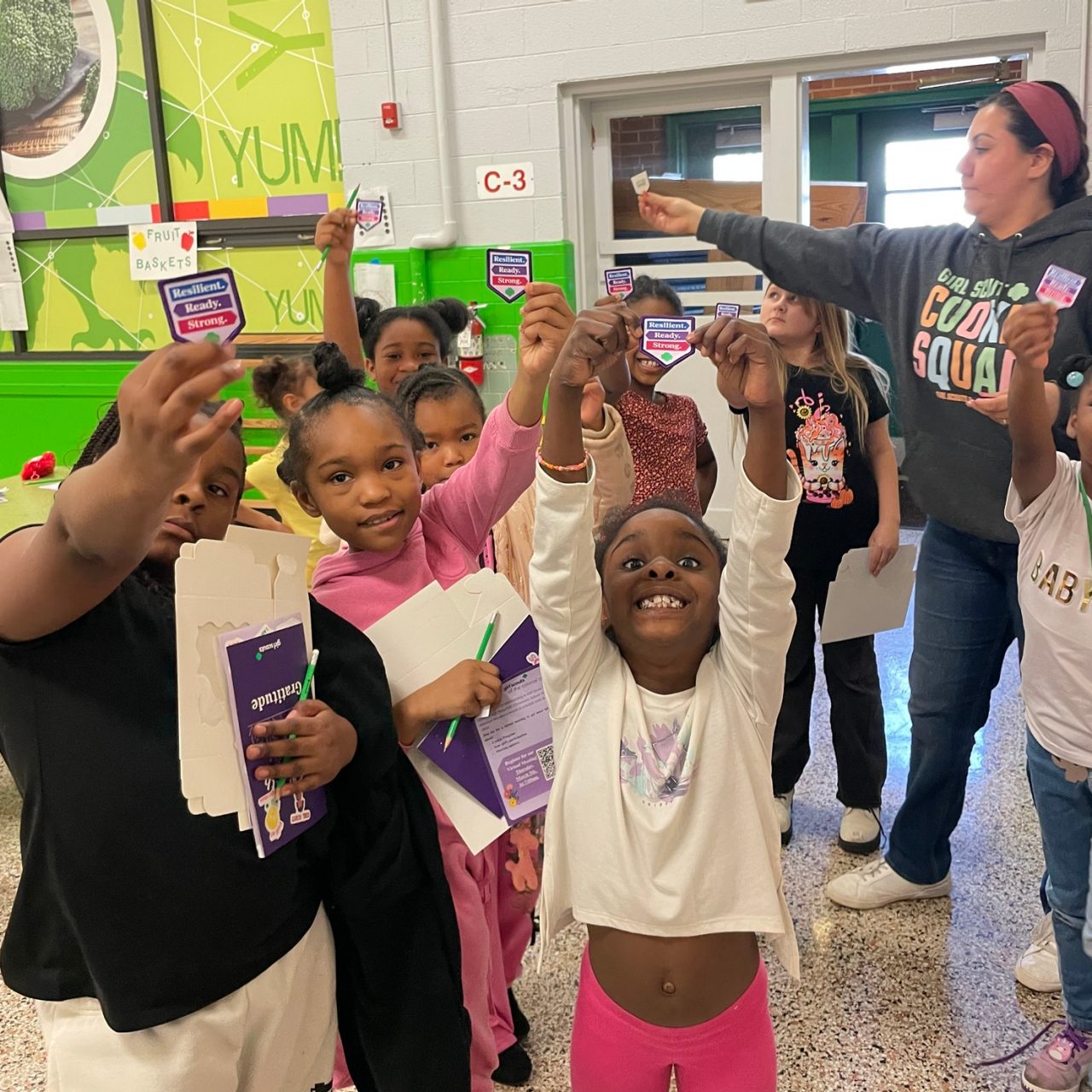 Girl Scouts show off the patch they have just earned together
