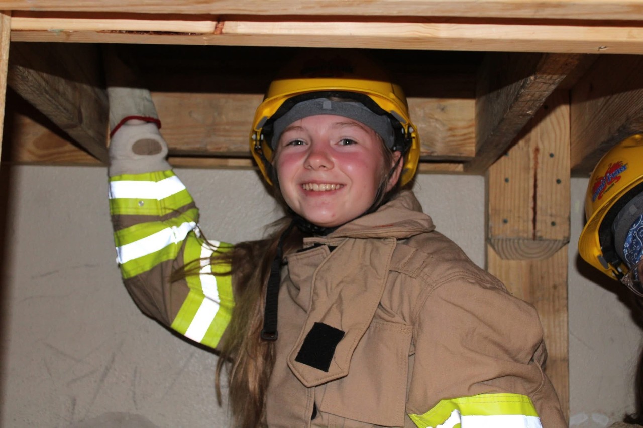 Girl Scout Senior Brianna in full turnout gear during an exercise