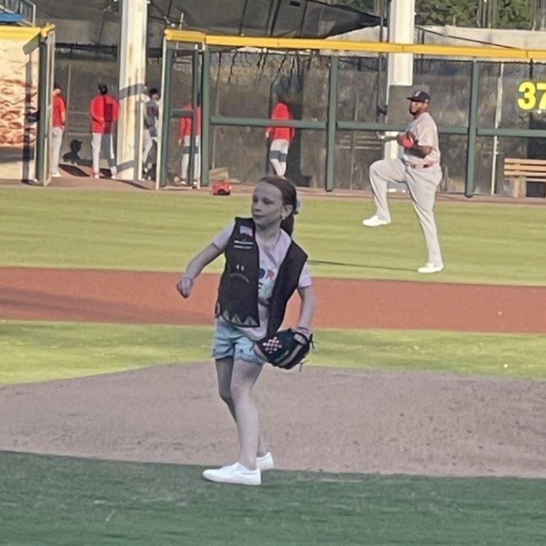 Girl Scout Brownie Faylen threw out the first pitch to start off the game for Girl Scout Night with the Tides