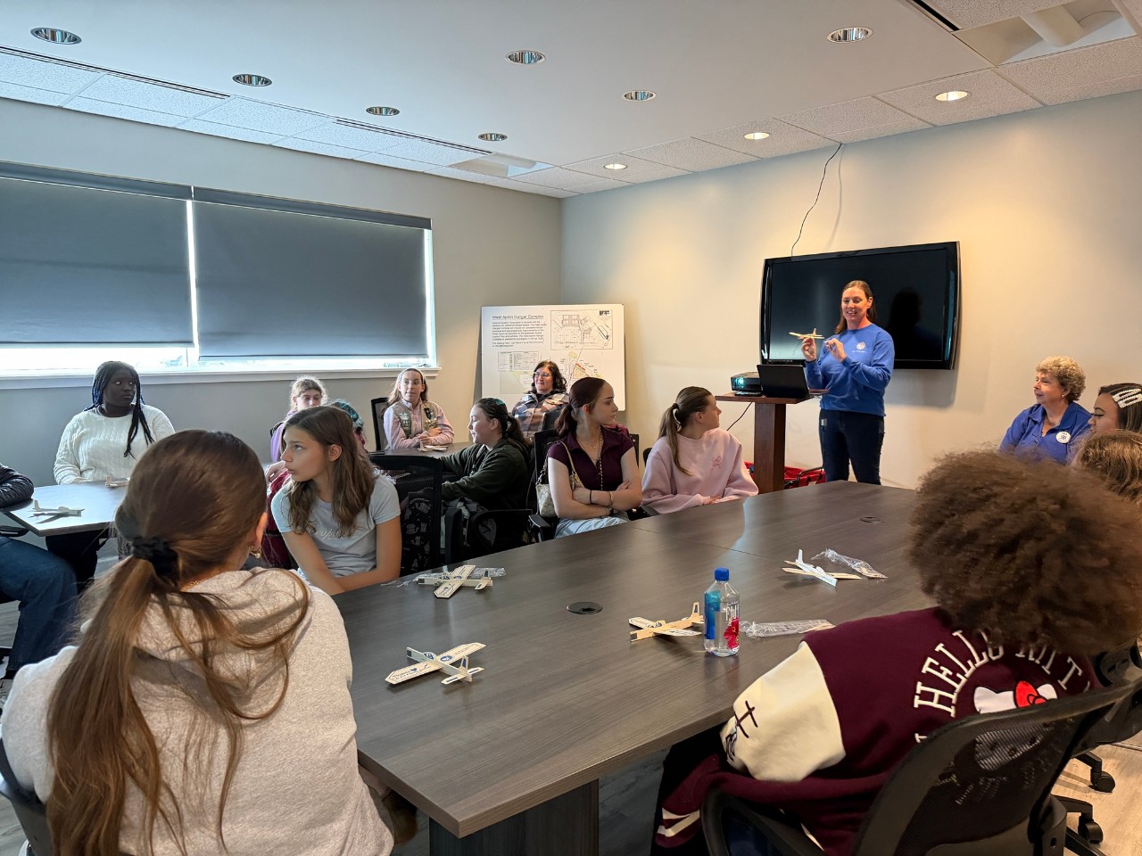 Girl Scouts attend a presentation from Sarah Oxley and Linda Bangert