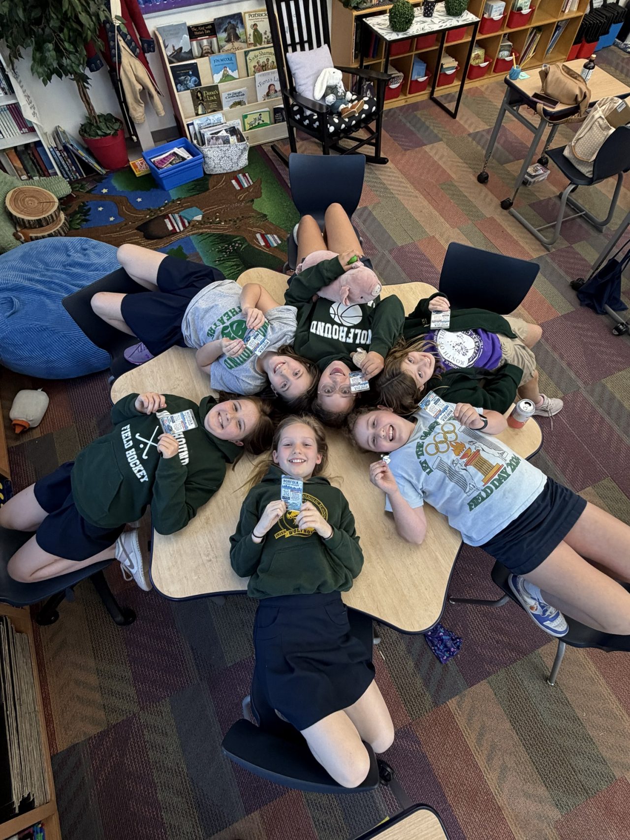 The troop poses in a circle after making and laminating their cards.