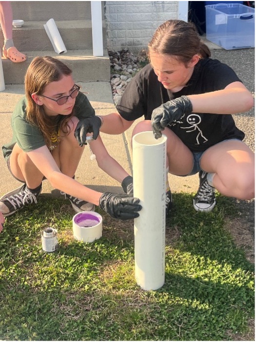 Girl Scout Cadettes building PVC tubes for recycling