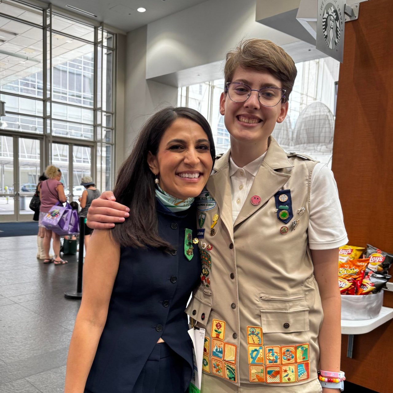 Girl Scout Alex poses with GSUSA National President Noorain Khan