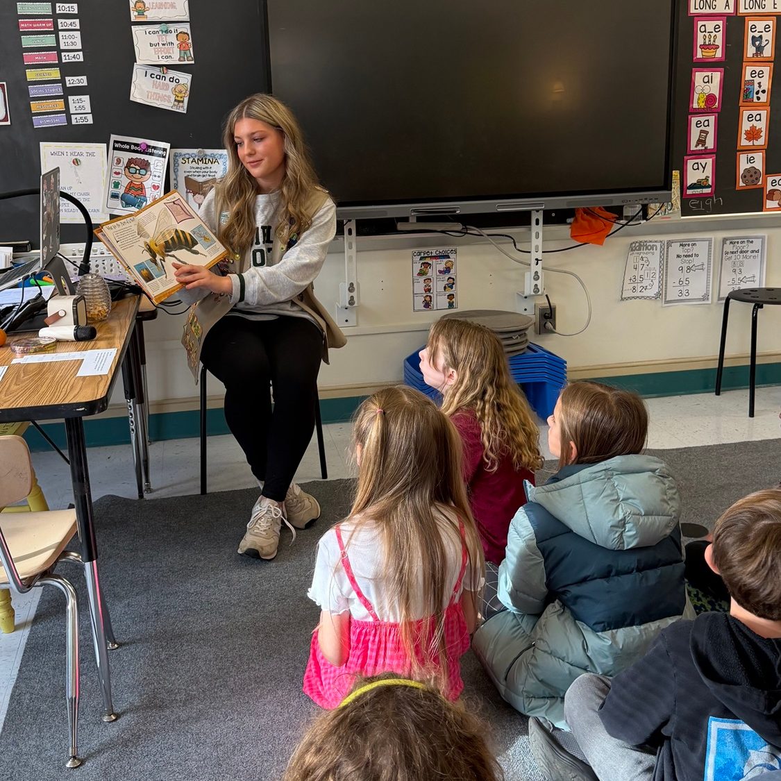 Girl Scout Madison read the storybook, “You Wouldn’t Want to Live Without Bees” and led an interactive hands-on game at each student session