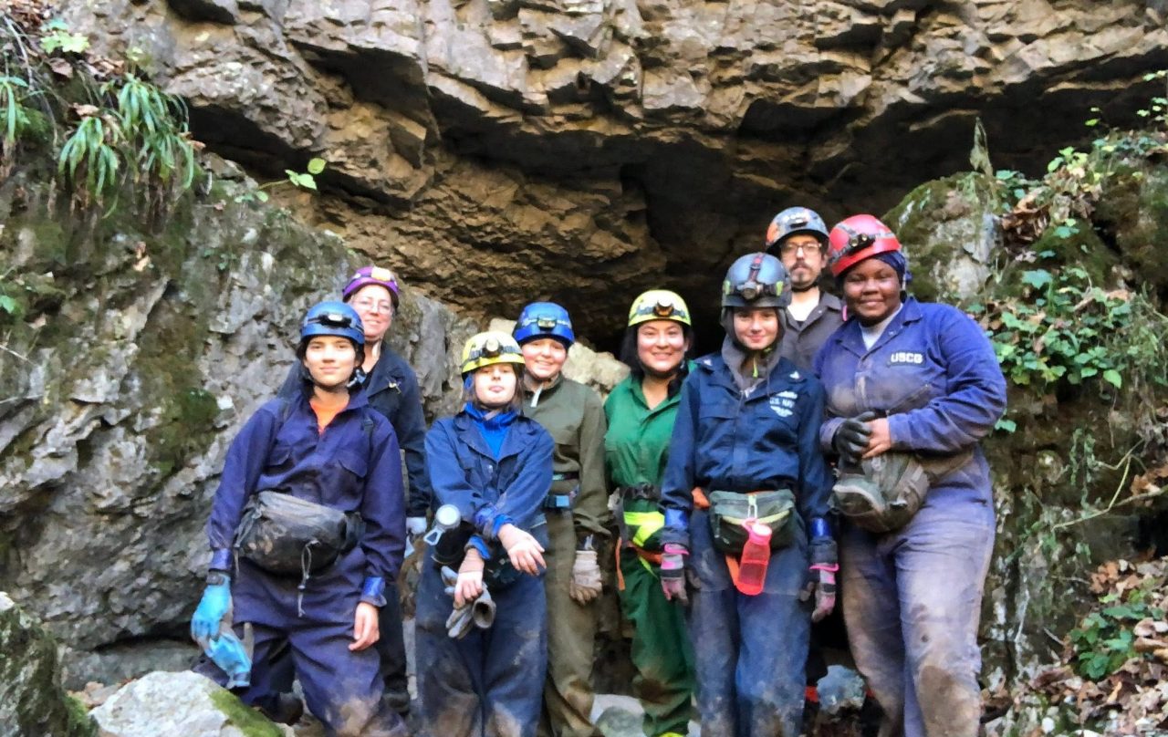 Cavers outside of Snedeker’s Cave, part of the Friars Hole Cave System that is the longest cave system in West Virginia