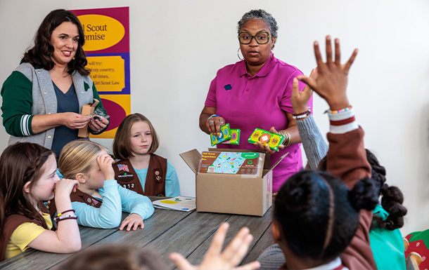 Troop co-leaders running a Girl Scout troop meeting