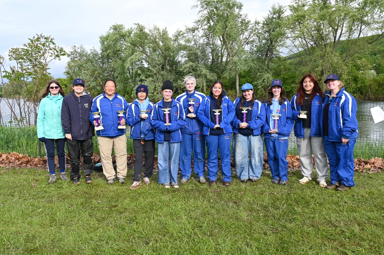 The GSCCC Blazing Blue Herons Canoe Team with trophies from a recent competition