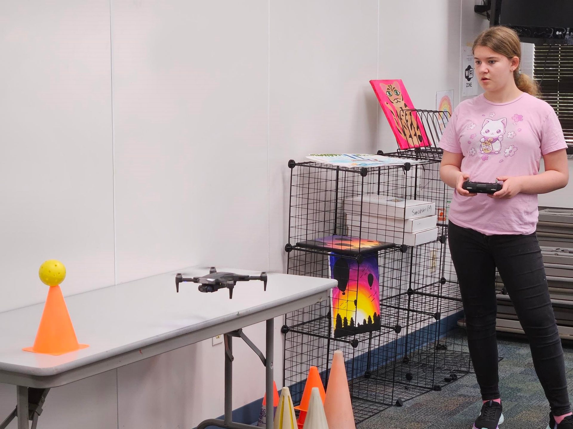 GSCCC Drone Club practicing piloting a drone indoors