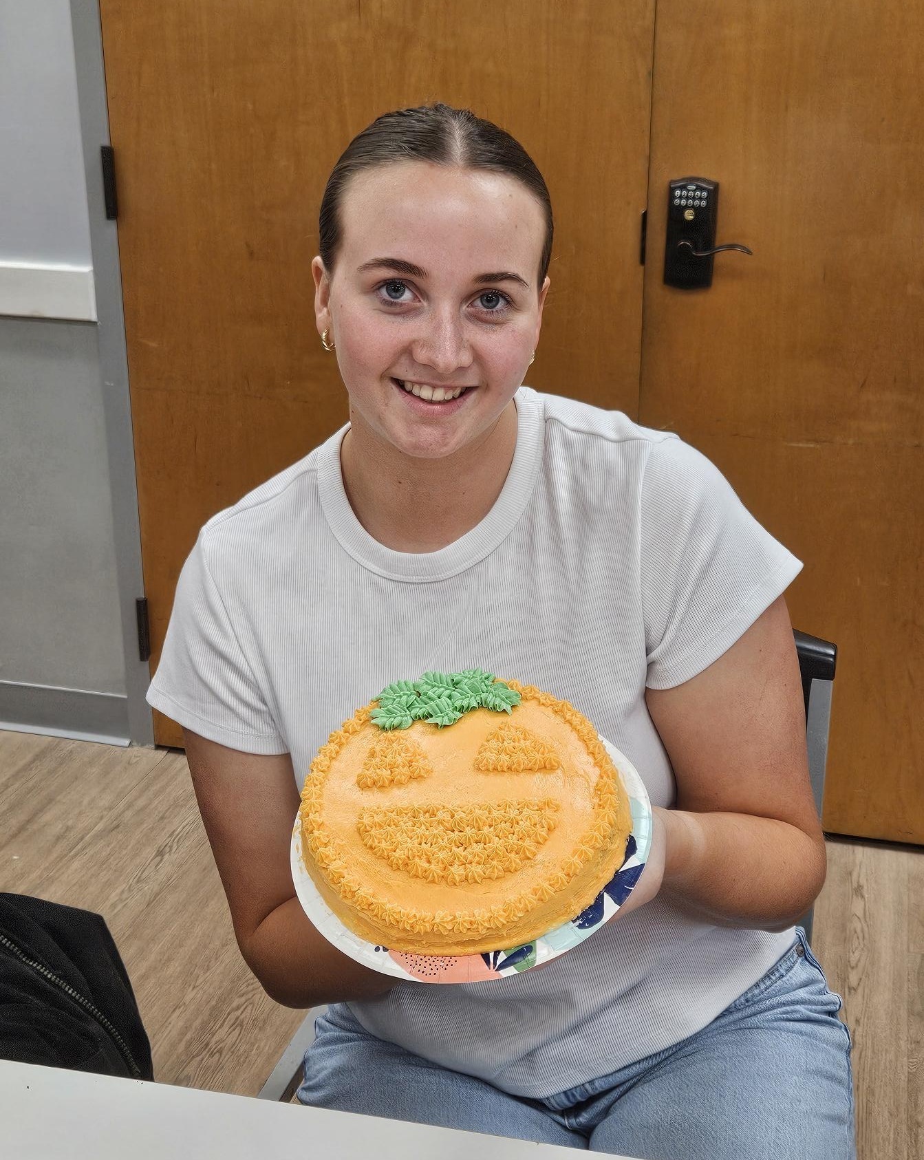 Girl Scout at a meeting of the GSCCC Cooking Club shows off her decorated cake