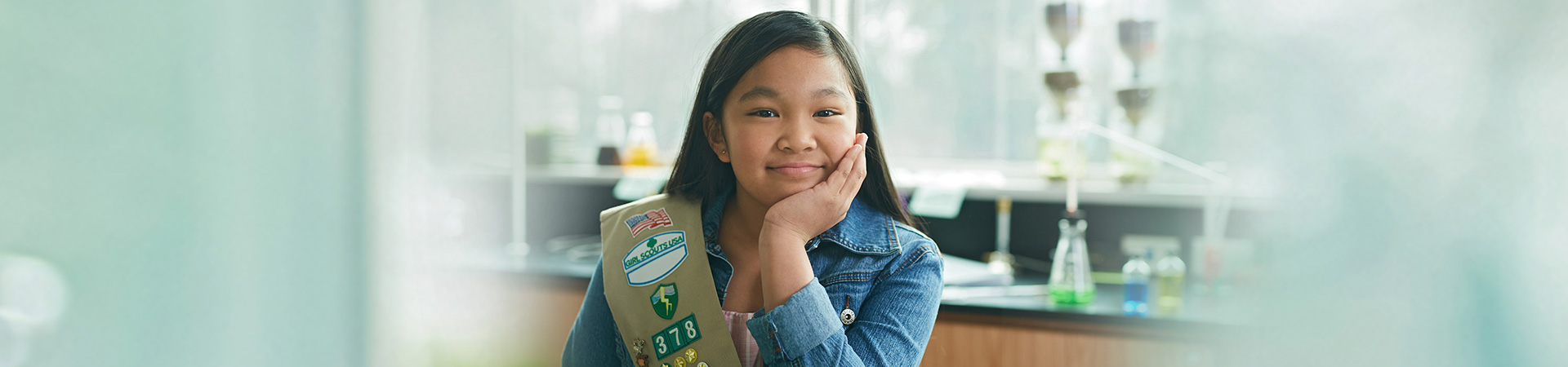  Girl Scout Cadette earning her Silver Award at an event with her troop 