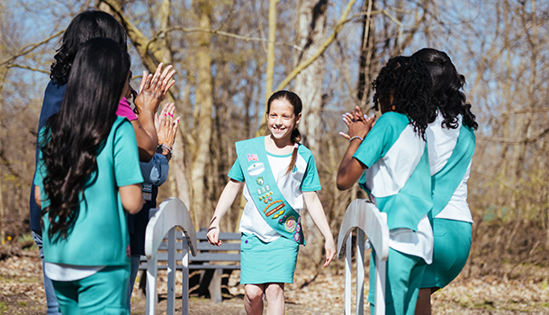 Girl Scout Juniors in uniform at a bridging ceremony