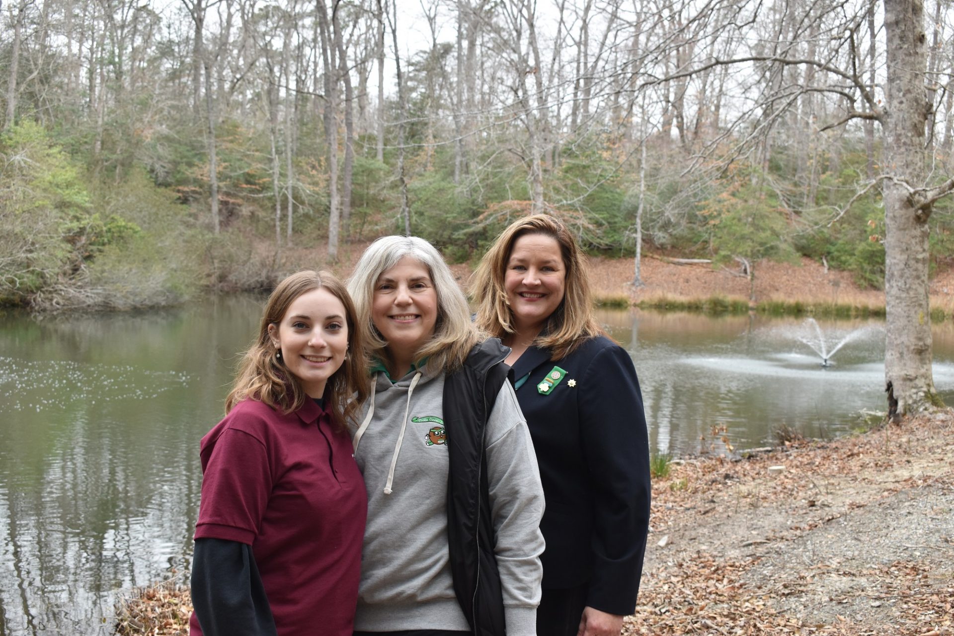 Gold Award Girl Scout Claire Pittman, GSCCC Board Vice Chair Carolyn Pittman, alongside GSCCC CEO Tracy Keller in front of the “Claire’s Dancing Waters” installment at Camp Skimino in Williamsburg.