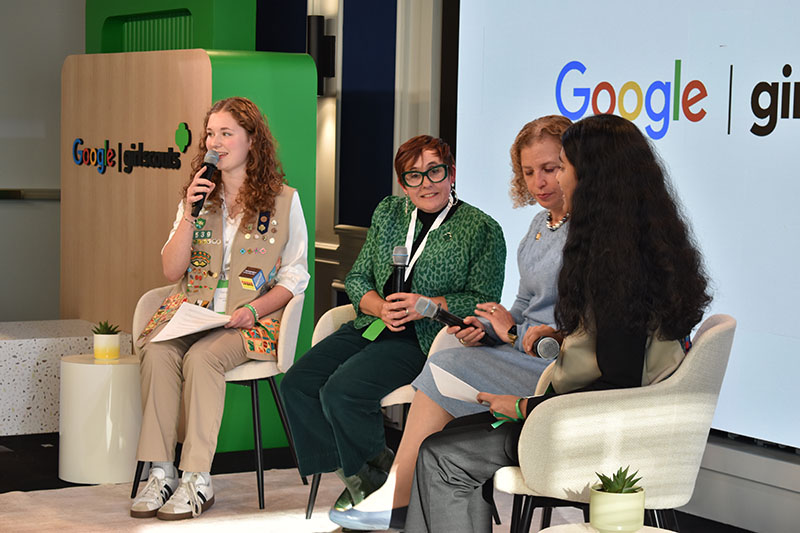 Martha-Ann W. (far left) on stage alongside Girl Scouts USA Chief Development Officer Meredith Maskara (second from left) and Florida Rep. Debbie Wasserman Schultz