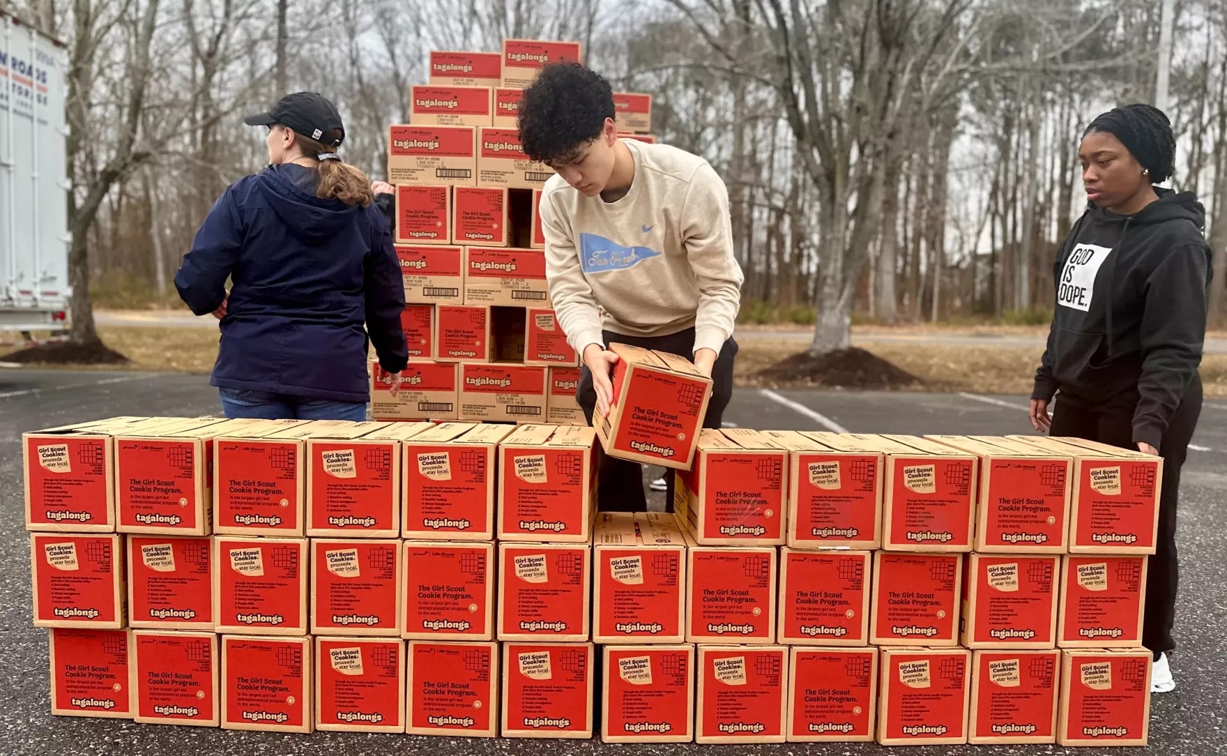 Volunteers prepare boxes of Girl Scouts cookies at the region's Cookie Count ’n’ Go event to distribute boxes to local troops.