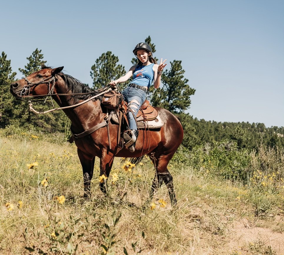 Girl Scout Lexie on a horse